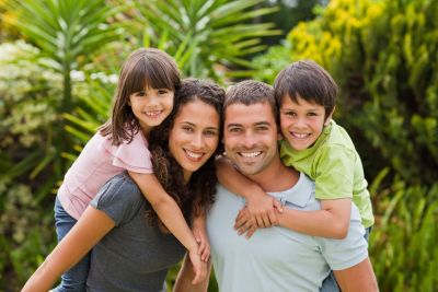 Family discussing life insurance options in Suite 501, CA